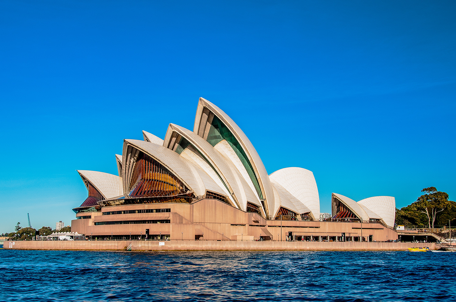 The Sydney Opera House near the beautiful sea under the clear blue sky